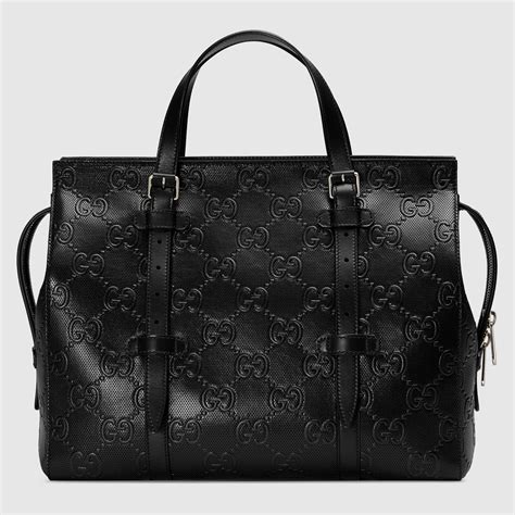 embossed gucci purse
